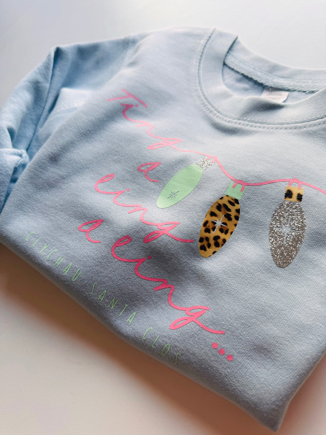 Girls “Ting a ling a ling… Clychau santa clos” sky blue sweater