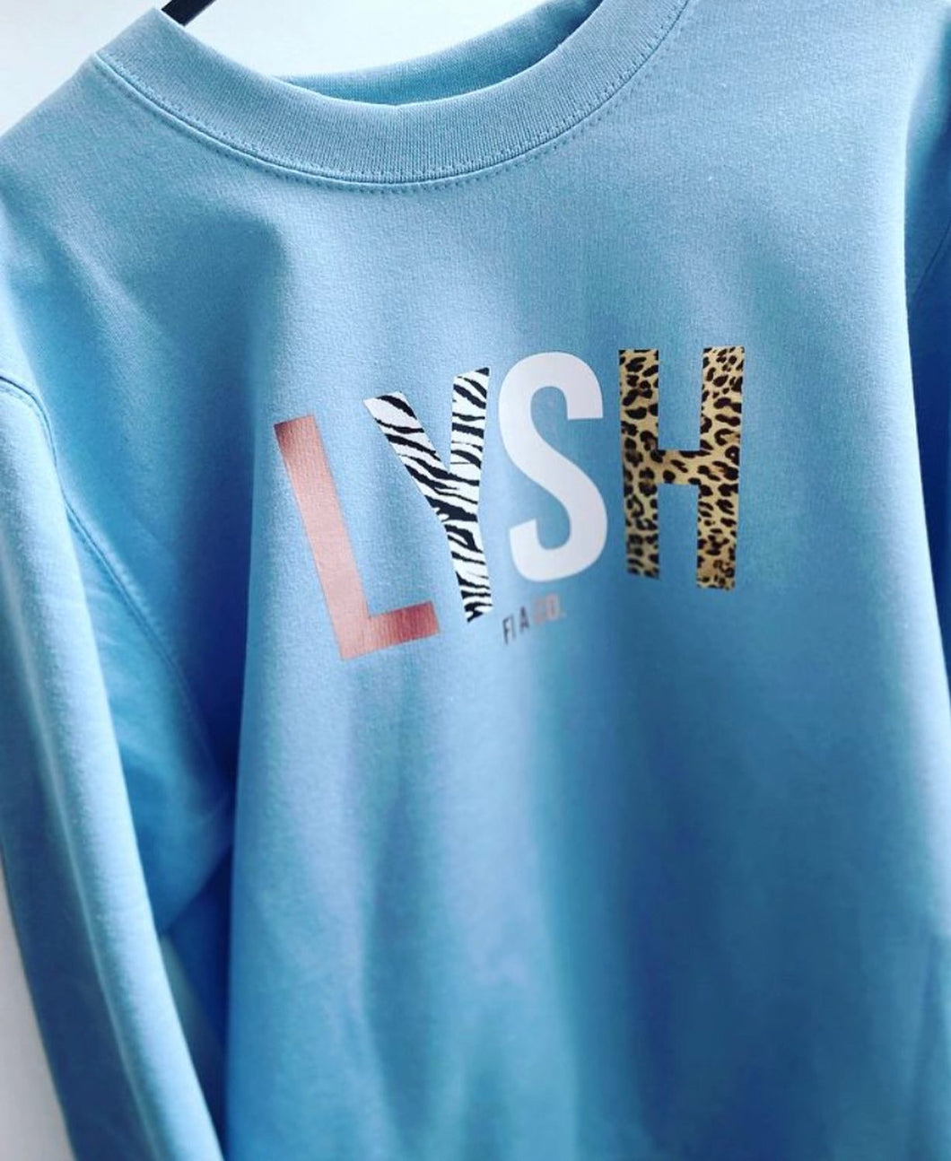 “LYSH” baby blue sweater