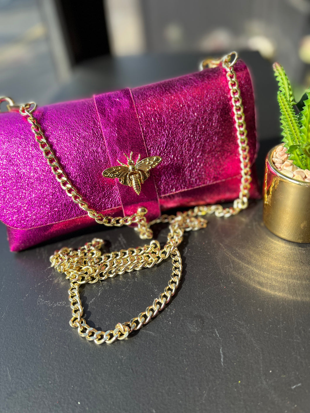 Metallic clutch bag